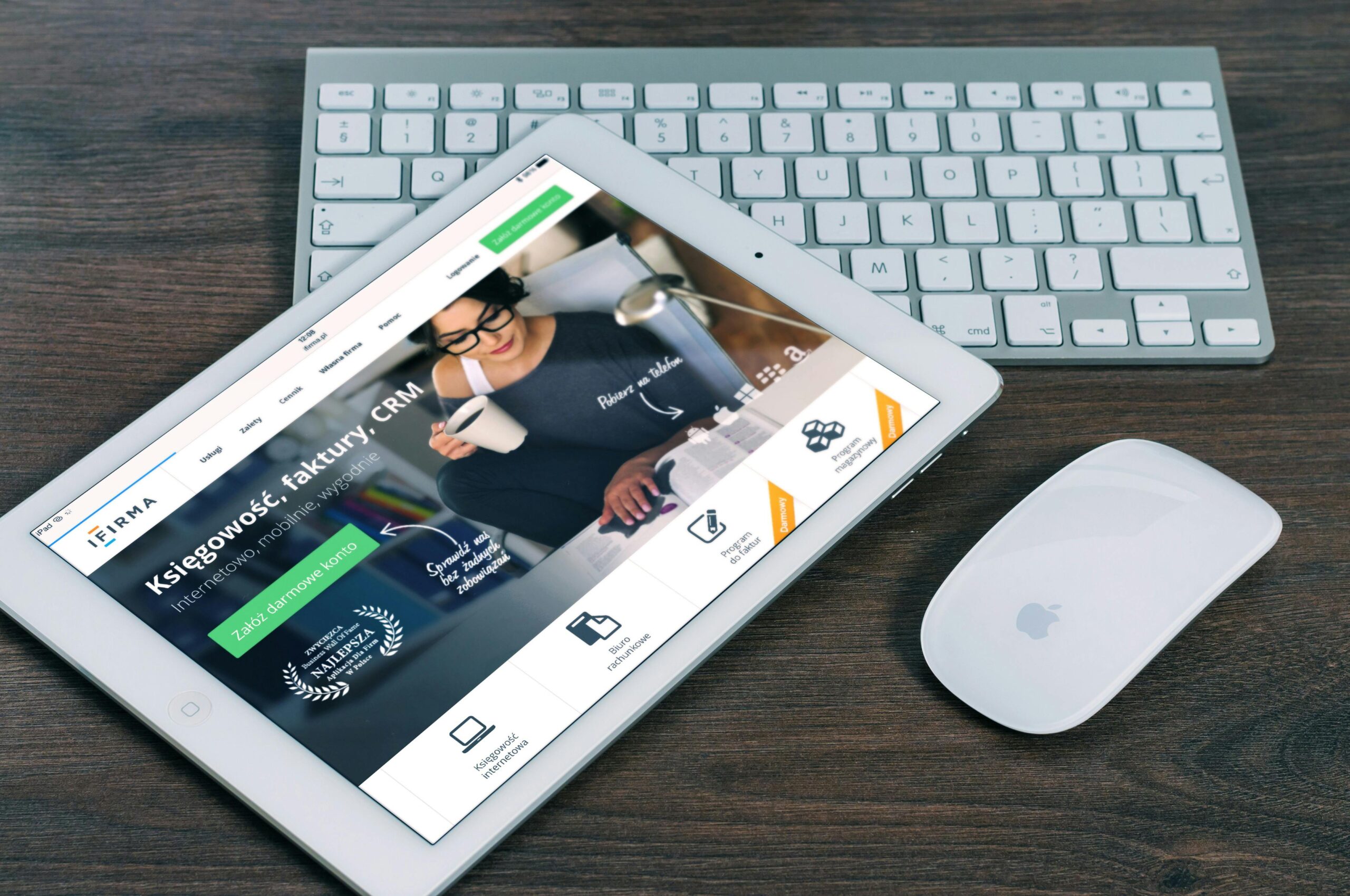 Home A tablet with a financial website open, alongside a white keyboard and mouse. Ideal for tech-theme stock images.